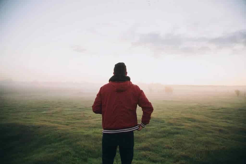 The Ultimate Day Hiking Checklist-man-red-clouds