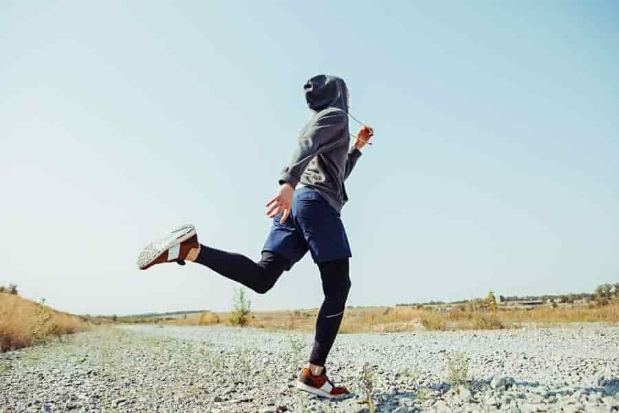 hiker in compression pants running