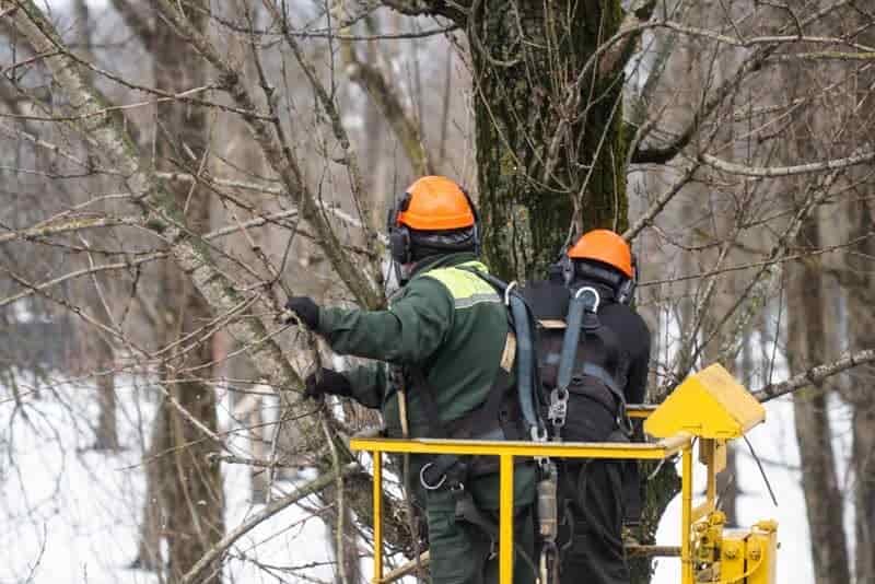 Outdoor workers in winter with heated coats