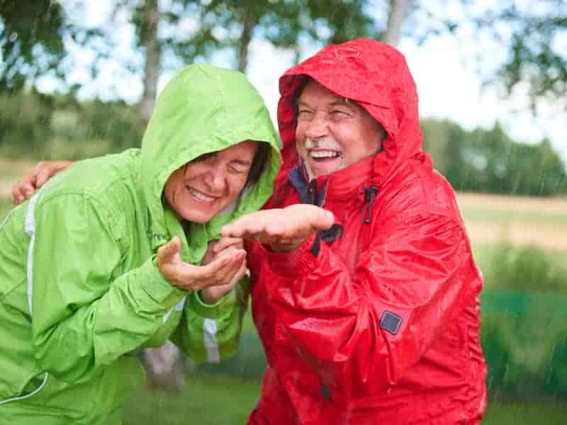 having fun camping in the rain with waterproofs on